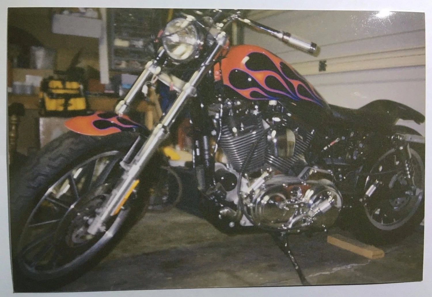 Vintage PHOTO Custom Harley Davidson Motorcycle with Flame Paint Job Rests on Wood